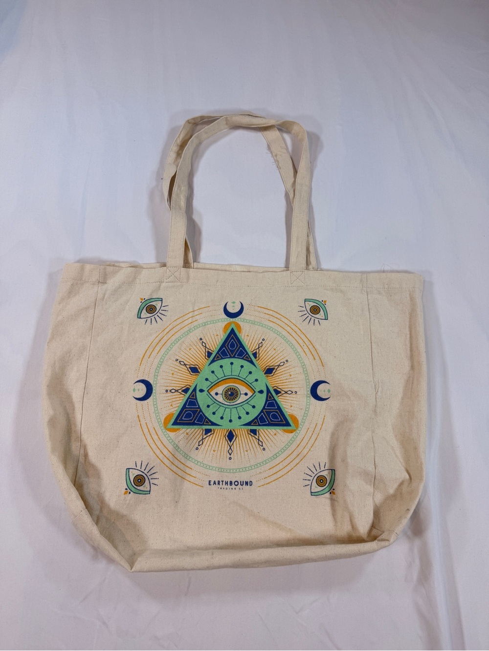 Earthbound Trading Cream Canvas Tote vibrant, esoteric "All Seeing Eye" design